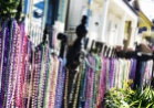 Shortly after Mardi Gras 2013, beads still adorn a fence along Magazine Street in the Garden District.