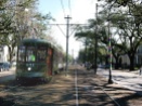 A streetcar heads down St. Charles Avenue. The neutral ground - the local term for the street median -- is a popular place for runners because of its long unbroken stretch and the soft but sure footing it provides.