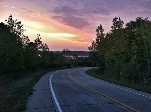The sun begins to break through the clouds on Mississippi River Road on a September Sunday morning. We've started on long runs before the sun comes up this summer to avoid as much of the heat as possible.